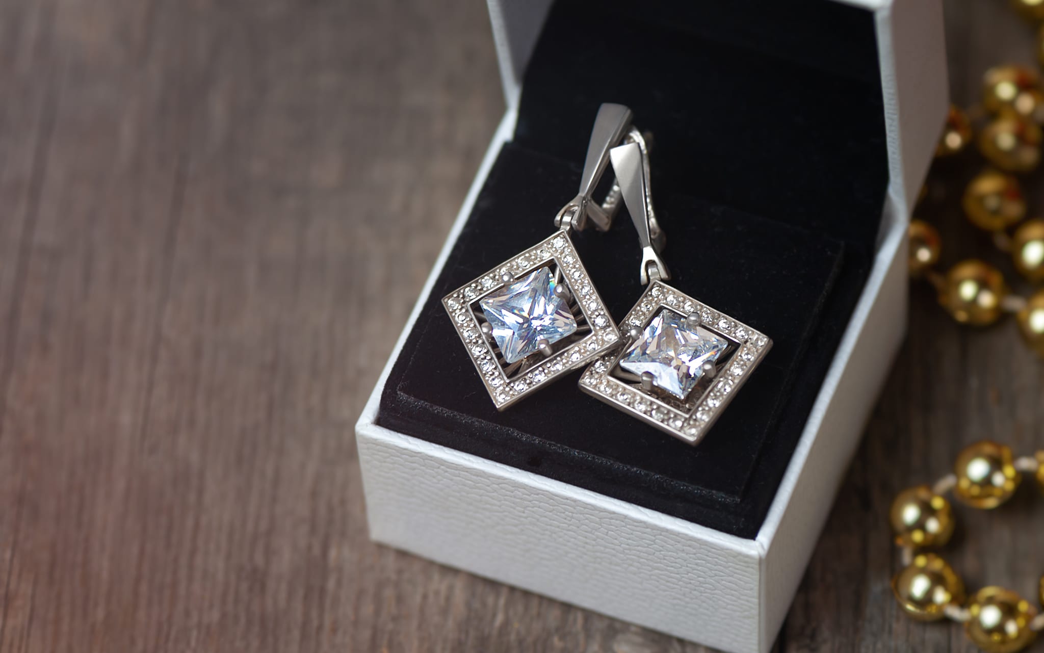 Silver earrings with fianits in white gift box. Gift for Christmas.